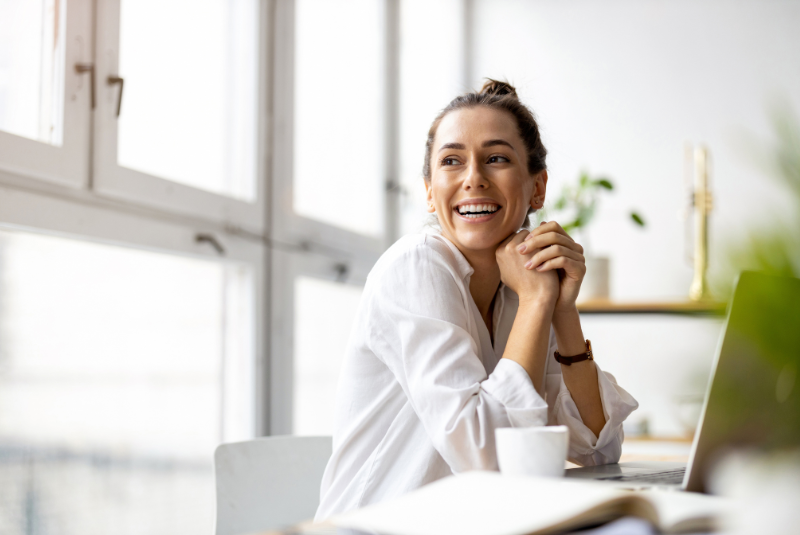 Woman smiling in boardroom